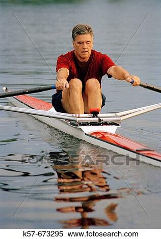 Man rowing a single scull View Large Photo Image Stock Photography - Man rowing a single scull. Fotosearch