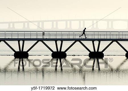 Man running at Lisbon's parque das na??es View Large Photo Image Stock Image - Man running at Lisbon's parque das na??es. Fotosearch