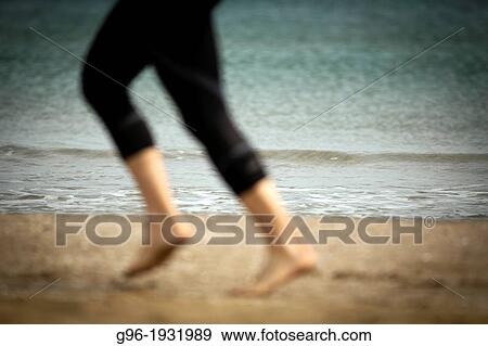 Man running at the beach View Large Photo Image Stock Photo - Man running at the beach. Fotosearch
