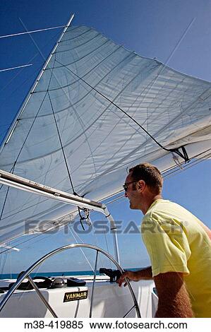 Man sailing a catamaran in Key West, Florida. December 2004. View Large Photo Image Stock Photography - Man sailing a catamaran in Key West, Florida. December 2004.. Fotosearch