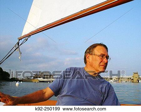 Stock Photo - Man sailing in Chesapeake Bay. Maryland. USA. Fotosearch