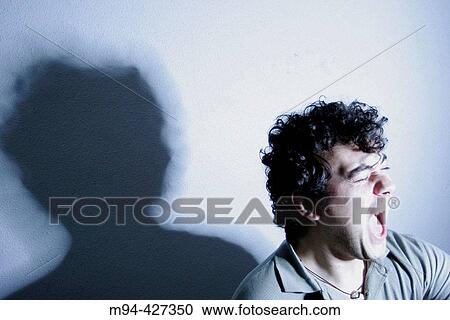 Man scared of something that comes towards him. View Large Photo Image Stock Image - Man scared of something that comes towards him.. Fotosearch
