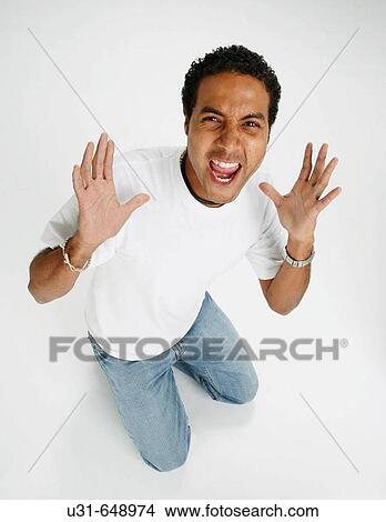 Picture - Man screams in studio. Fotosearch