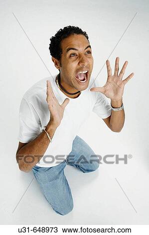 Stock Image - Man screams in studio. Fotosearch