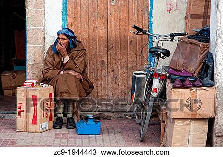 Man selling cigarrets in Essaouira medina, Morocco. View Large Photo Image Stock Image - Man selling cigarrets in Essaouira medina, Morocco.. Fotosearch