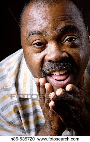 Stock Image - Man shaving face. Fotosearch