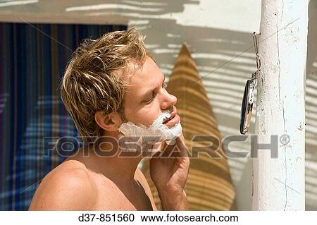 Man shaving himself outdoors View Large Photo Image Stock Image - Man shaving himself outdoors. Fotosearch