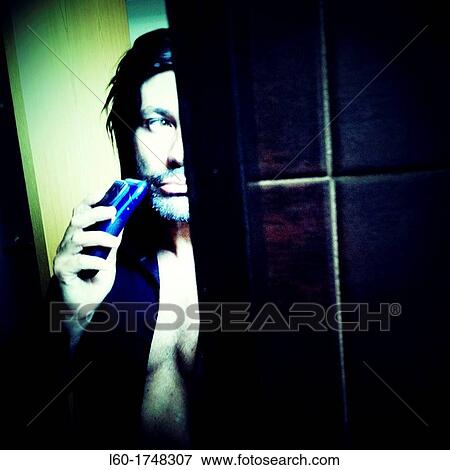 Man shaving with electric razor, Portrait View Large Photo Image Stock Photo - Man shaving with electric razor, Portrait. Fotosearch