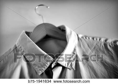 Man shirt on a hanger View Large Photo Image Picture - Man shirt on a hanger. Fotosearch