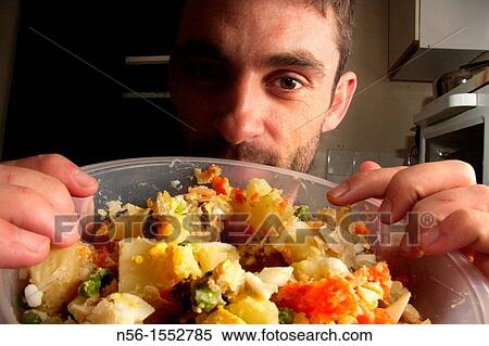 MAN SHOWING MEAL View Large Photo Image Stock Photography - MAN SHOWING MEAL. Fotosearch