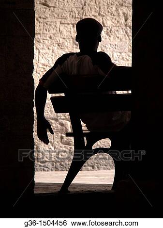 Man sits on bench in Todi, Perugia, Italy View Large Photo Image Stock Photograph - Man sits on bench in Todi, Perugia, Italy. Fotosearch