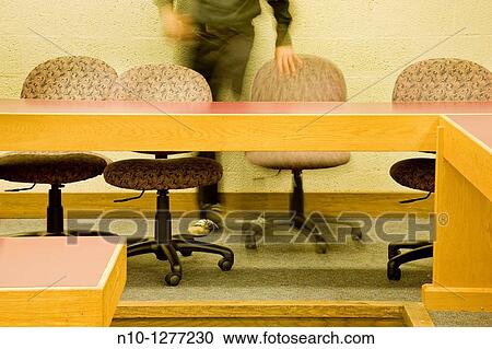 Man sitting in a college classroom View Large Photo Image Stock Image - Man sitting in a college classroom. Fotosearch