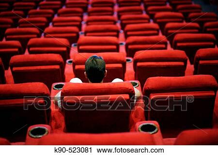 Man sitting in empty cinema View Large Photo Image Stock Image - Man sitting in empty cinema. Fotosearch