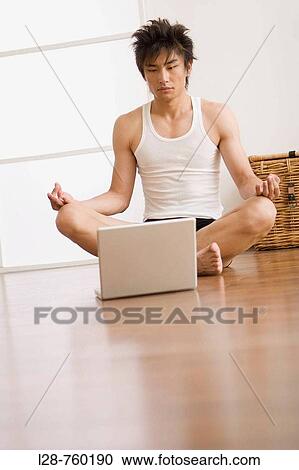 Man sitting in lotus position on floor with computer View Large Photo Image Stock Image - Man sitting in lotus position on floor with computer. Fotosearch