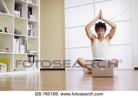 Man sitting in lotus position on floor with computer View Large Photo Image Stock Photo - Man sitting in lotus position on floor with computer. Fotosearch