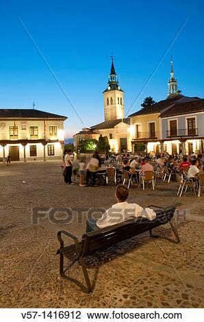 Man sitting on bench, Segovia Square. Night view. Navalcarnero, Madrid province, Spain. View Large Photo Image Stock Image - Man sitting on bench, Segovia Square. Night view. Navalcarnero, Madrid province, Spain.. Fotosearch