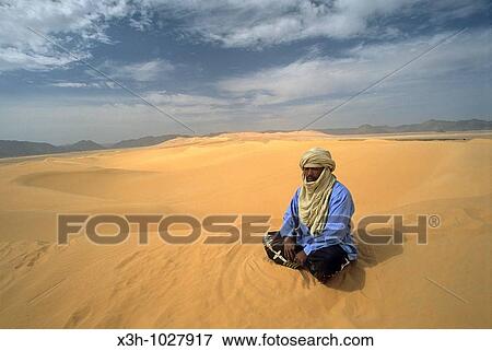 man sitting on dunes of Arakao, A? r, Niger, Western Africa View Large Photo Image Stock Photo - man sitting on dunes of Arakao, A? r, Niger, Western Africa. Fotosearch