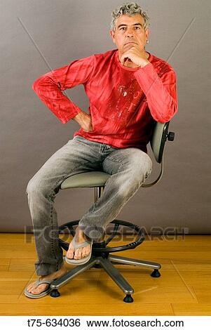 Stock Photograph - Man sitting. Fotosearch