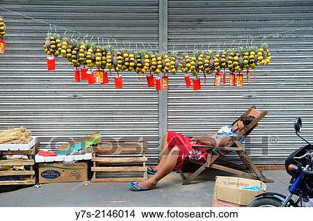 Man sleeping in Binondo, Manila's Chinatown, Philippines, South East Asia. View Large Photo Image Picture - Man sleeping in Binondo, Manila's Chinatown, Philippines, South East Asia.. Fotosearch