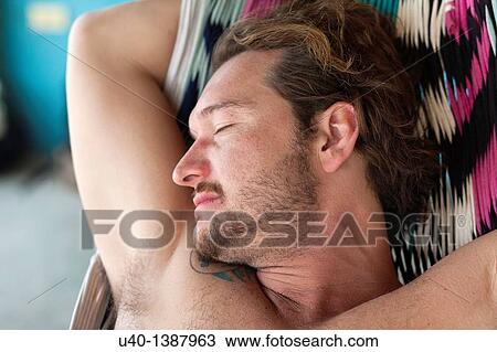 Man sleeping on hammock View Large Photo Image Stock Image - Man sleeping on hammock. Fotosearch