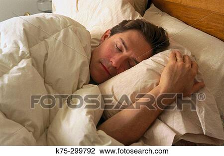Stock Image - man sleeping. Fotosearch