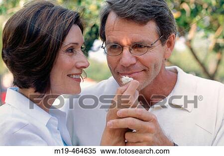 man smelling a flower View Large Photo Image Stock Photography - man smelling a flower. Fotosearch