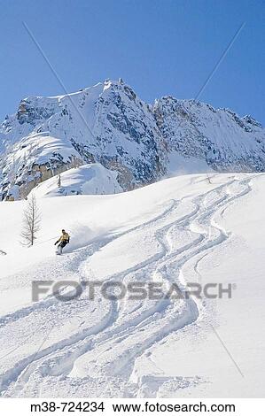 Man snowboarding, North Cascades, Washington, USA View Large Photo Image Picture - Man snowboarding, North Cascades, Washington, USA. Fotosearch