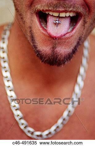 Stock Photography - Man sticking out the tongue, South Beach. Miami, Florida. USA. Fotosearch