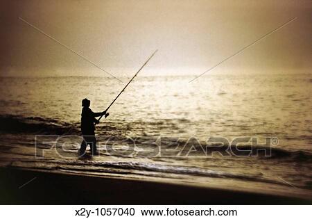 Man surf fishing, Cape Cod, MA View Large Photo Image Stock Image - Man surf fishing, Cape Cod, MA. Fotosearch