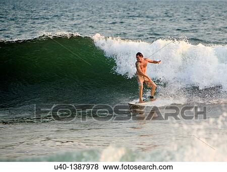 Stock Photo - Man surfing. Fotosearch