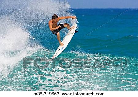 Man surfing, Sunset Beach, North Shore, Oahu, Hawaii, USA View Large Photo Image Stock Photo - Man surfing, Sunset Beach, North Shore, Oahu, Hawaii, USA. Fotosearch