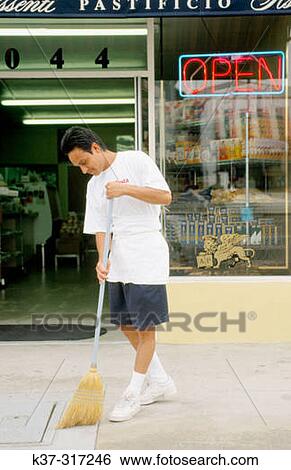 Man sweeping sidewalk outside Italian pasta store in San Diego. USA View Large Photo Image Stock Photograph - Man sweeping sidewalk outside Italian pasta store in San Diego. USA. Fotosearch