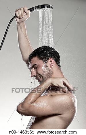 Man takes a shower View Large Photo Image Stock Photography - Man takes a shower. Fotosearch