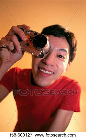 Man taking a photo. View Large Photo Image Stock Photo - Man taking a photo.. Fotosearch