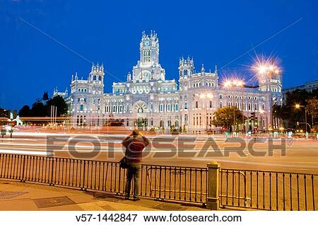 Man taking photos at Cibeles Square, night view. Madrid, Spain. View Large Photo Image Stock Photo - Man taking photos at Cibeles Square, night view. Madrid, Spain.. Fotosearch