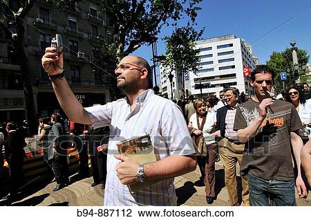 Man taking pictures in La Rambla, Barcelona. Catalonia, Spain View Large Photo Image Stock Image - Man taking pictures in La Rambla, Barcelona. Catalonia, Spain. Fotosearch
