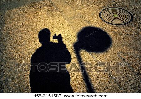 man taking pictures of his own shadow, Valencia, Spain View Large Photo Image Stock Photo - man taking pictures of his own shadow, Valencia, Spain. Fotosearch