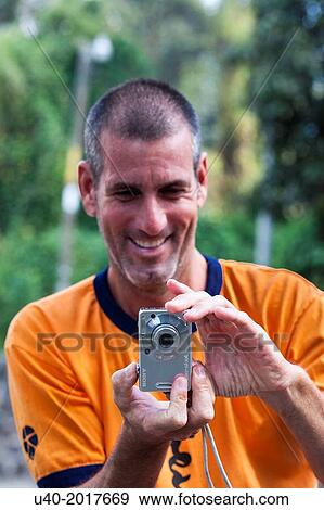 Man taking pictures. View Large Photo Image Stock Photo - Man taking pictures.. Fotosearch