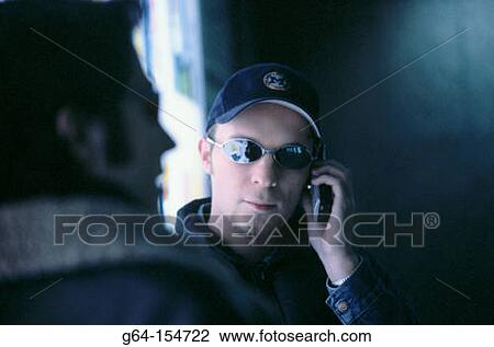 Man talking on cell phone View Large Photo Image Stock Image - Man talking on cell phone. Fotosearch
