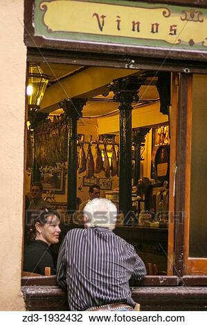 Man talking to a friend by a window in a typical bar of Granada, Andalusia, Spain View Large Photo Image Stock Image - Man talking to a friend by a window in a typical bar of Granada, Andalusia, Spain. Fotosearch