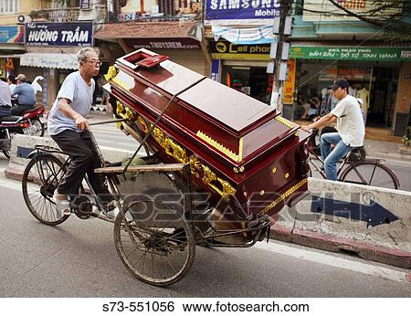 Man transporting a coffin on rickshaw. Hanoi. Vietnam. View Large Photo Image Stock Photograph - Man transporting a coffin on rickshaw. Hanoi. Vietnam.. Fotosearch