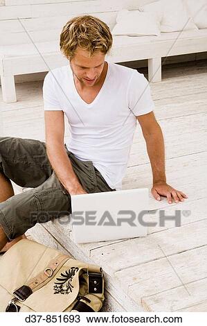 Man typing on the laptop View Large Photo Image Stock Image - Man typing on the laptop. Fotosearch