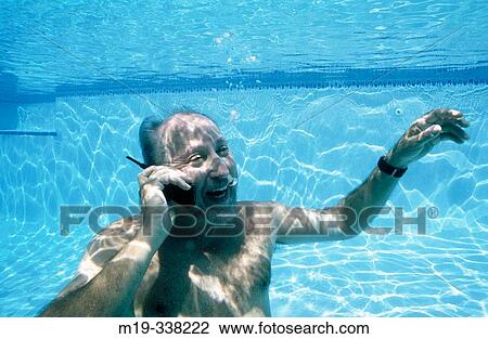 man underwater on cellular View Large Photo Image Stock Image - man underwater on cellular. Fotosearch