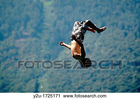 Man upside down in the air with swimming wear View Large Photo Image Stock Image - Man upside down in the air with swimming wear. Fotosearch