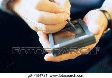 Man using a PDA View Large Photo Image Stock Image - Man using a PDA. Fotosearch