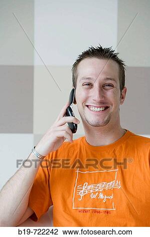 Man using cell phone View Large Photo Image Stock Image - Man using cell phone. Fotosearch