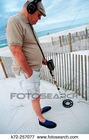Man using metal detector. Panama City beach, Florida. USA View Large Photo Image Stock Photo - Man using metal detector. Panama City beach, Florida. USA. Fotosearch