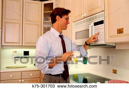 Man using microwave View Large Photo Image Stock Image - Man using microwave. Fotosearch