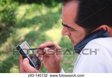 Man using PDA View Large Photo Image Stock Image - Man using PDA. Fotosearch