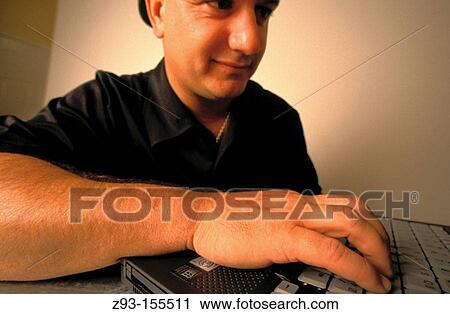 Stock Image - Man using personal computer. Fotosearch